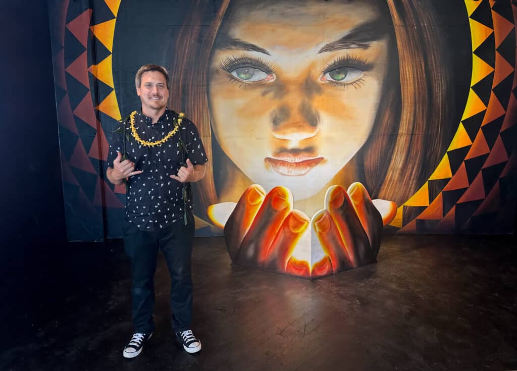 "Mālamalama" by Kamea Hadar (pictured here) represents youth passing knowledge to future generations. Photo by Sarah Burchard.