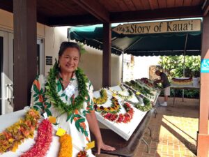 Woman in lei stand