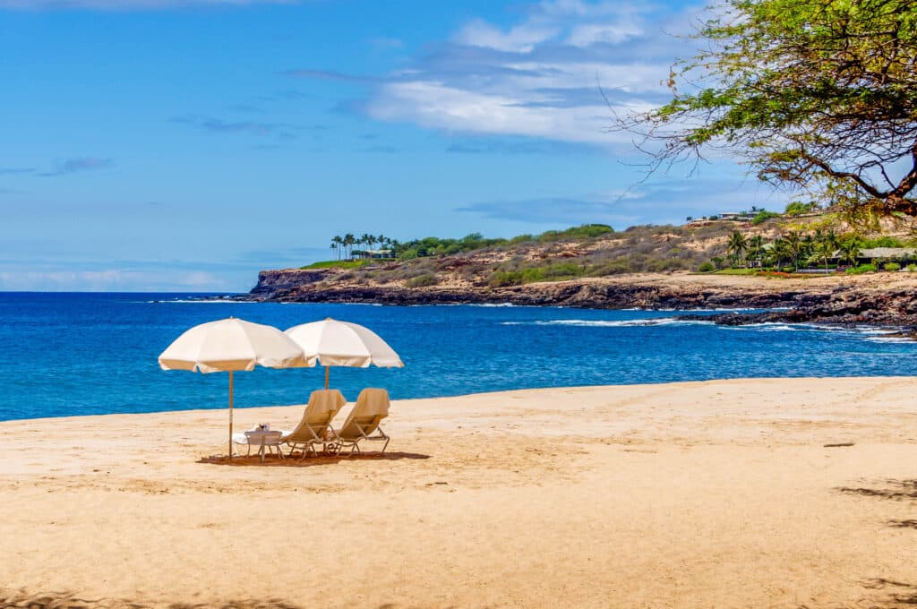 Beach chairs and umbrellas await the visitor to the island of Lanai, Hawaiihateii hawiia hawaii. hawaiii hawiaii hwaii hawaai hawall hawii hawwai hawwaii hawwii hiwaii haiwaii hawia hawwi 395575513
